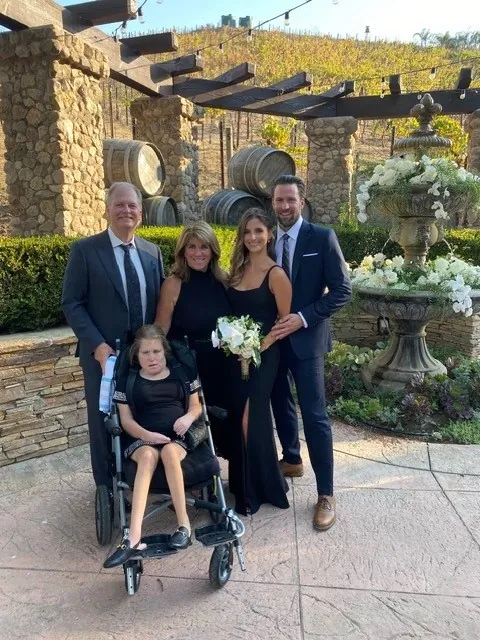 Carpenter Family Picture with Cortney, their firstborn child and the inspiration behind the establishment of an Inclusive Community for IDD.
